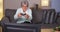 Elderly woman playing videogames