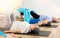 Elderly woman practicing pilates with ball in gym area