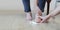 Elderly woman putting cream on swollen feet