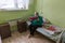 Elderly woman in rehabilitation department in Center of social services for pensioners and the disabled.