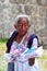 Elderly woman selling traditional mayan souvenirs