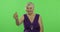 An elderly woman show thumb up and smiles. Old grandmother. Chroma key