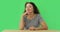 Elderly woman sitting at table