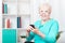 Elderly woman and smartphone