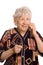 Elderly woman speaks on the phone