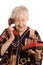 Elderly woman speaks on the phone