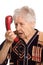 The elderly woman speaks on the phone