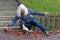 An elderly woman stumbles over a cat