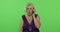 An elderly woman talks on a smartphone. Old grandmother smiles. Chroma key