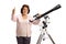 Elderly woman with a telescope looking at the camera and showing