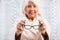 Elderly woman trying on eyeglasses