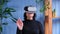 An elderly woman uses virtual reality glasses. The everyday future of the house. Older people and modern tech concept