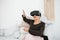 An elderly woman in virtual reality glasses. An elderly person using modern technology.