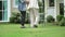 Elderly woman walking in backyard with daughter