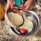 Elderly woman washing quinoa