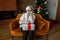 Elderly woman wearing face mask sad and alone at Christmas