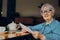 elderly woman working in front of laptop monitor sitting Lifestyle unaltered