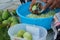 Elderly women prepare ingredients for cooking.