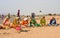 Elderly women prepare prasadam to a religious ceremony in a desert