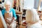 Elderly women talking in painting class