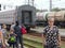 An elderly women waiting for her family at a Russian trainstation