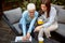 Elderly and young woman watching something on laptop