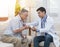 Elderman ask doctor about medicine