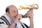 Eldery jewish man blowing the Shofar horn