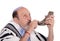 Eldery jewish man blowing the Shofar horn for Rosh Hashanah