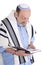 Eldery jewish man wrapped in talit praying