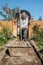 Eldery man kneads cement for pouring a garden path, garden construction work