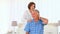 Eldery woman massaging her husbands neck