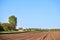 Elective blur on furrows on a Agricultural landscape near a farm, a plowed field in the countryside of Banatsko Novo Selo, Serbia,