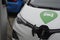 Electric autos park for recharge at charge point in Copenhagen