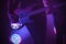 Electric bass guitar player in purple light