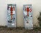 Electric boxes covered with graffiti stickers small paintings in Marfa, Texas.