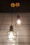 Electric bulbs hanging in dark room
