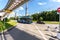 Electric bus travels along a city street along the monorail line next the Ostankino tv tower