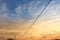 An electric cable with a panoramic background of a beautiful sunset against a yellowish blue sky in Cilacap Indonesia 13 Sept 20