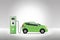 Electric car charging at charger service station with grey background. Hybrid Vehicle, Eco friendly auto or electric vehicle