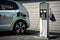 electric car charging station, with cables plugged in and car ready for departure