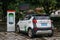 An electric car charging on the street in tourist city Yangshuo of China.