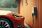 Electric car parking at home charging station, focus on wall charger