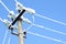 Electric communications wires covered with ice and snow. Snow-covered power cable lines and pole. Power electric transmission line