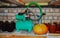 Electric compressor with motor on a shelf in the basement of the house, next to glass jars for storing canned juices from fruits