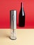 Electric corkscrew for wine opening..In the background there is a bottle of wine. Isolated