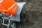 Electric cultivator cultivates soil in vegetable garden