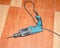 Electric drill, puncher lying on the tile floor