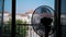 electric fan. Electric air Ventilator. Close-up. black silhouette of a working fan in the room, against the window