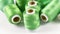 Electric green sewing thread coil